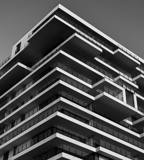 Grayscale Photo of Concrete Building